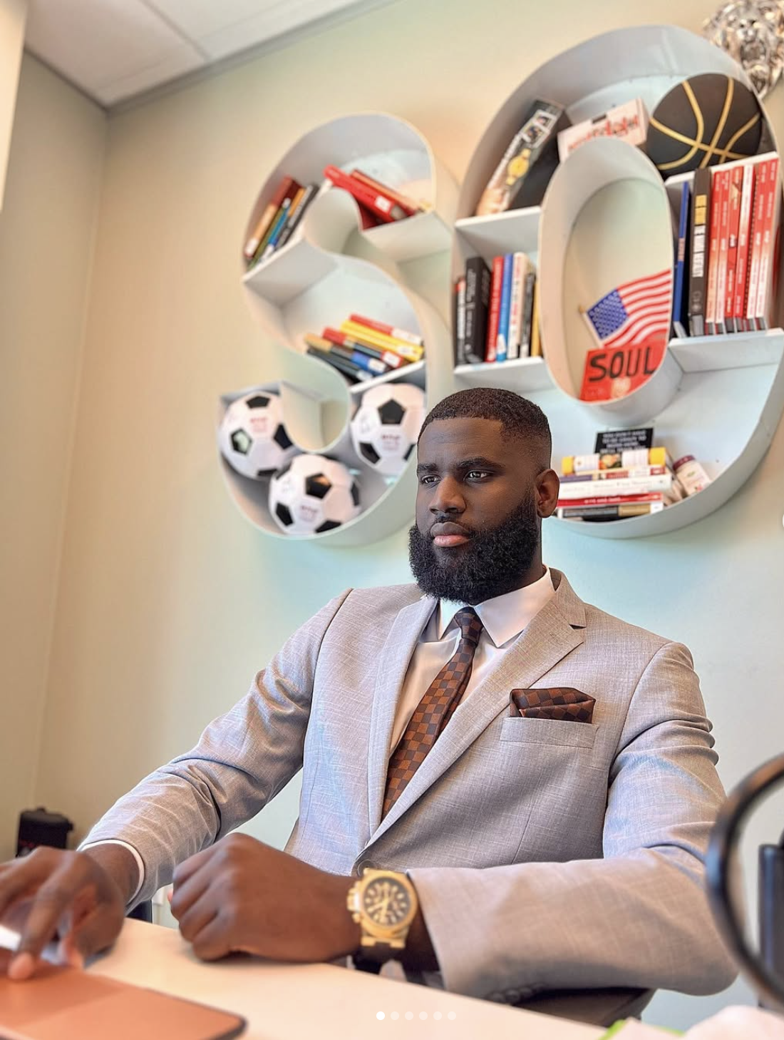 Okafor at his desk