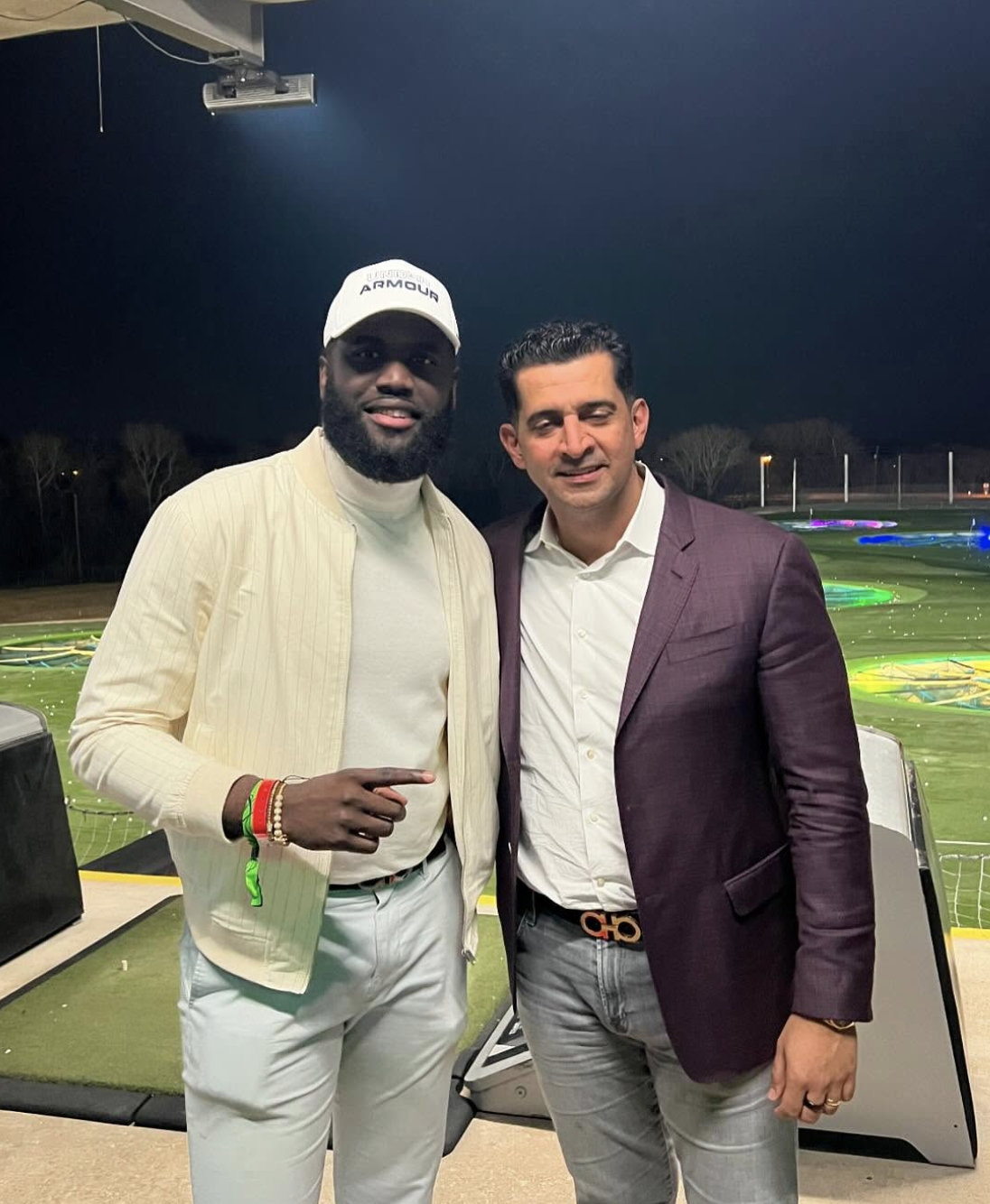 Okafor with Patrick Bet-David at TopGolf